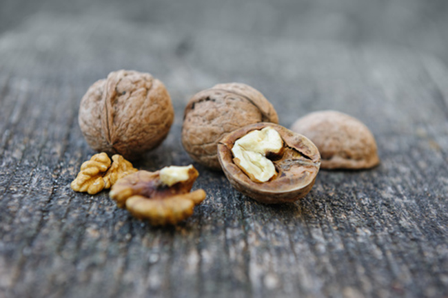 Walnuts at old wooden plank